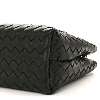 Black woven leather bag with curved corner and stitched pattern detail