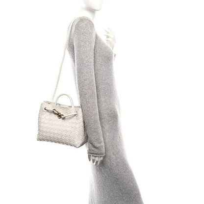 Bottega Veneta Small Andiamo woven nappa leather shoulder bag, white on a model