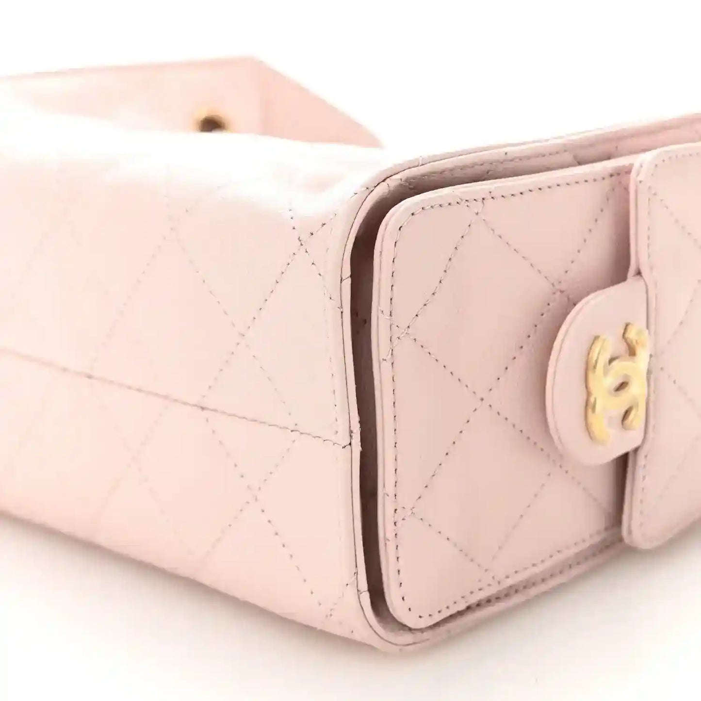 Light pink Chanel mini quilted leather handbag corner with round gold turn-lock