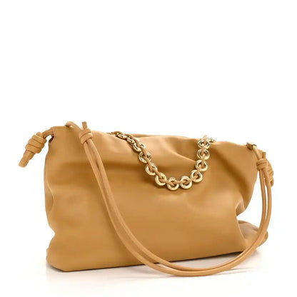 Tan leather clutch with braided chain strap and long leather shoulder strap