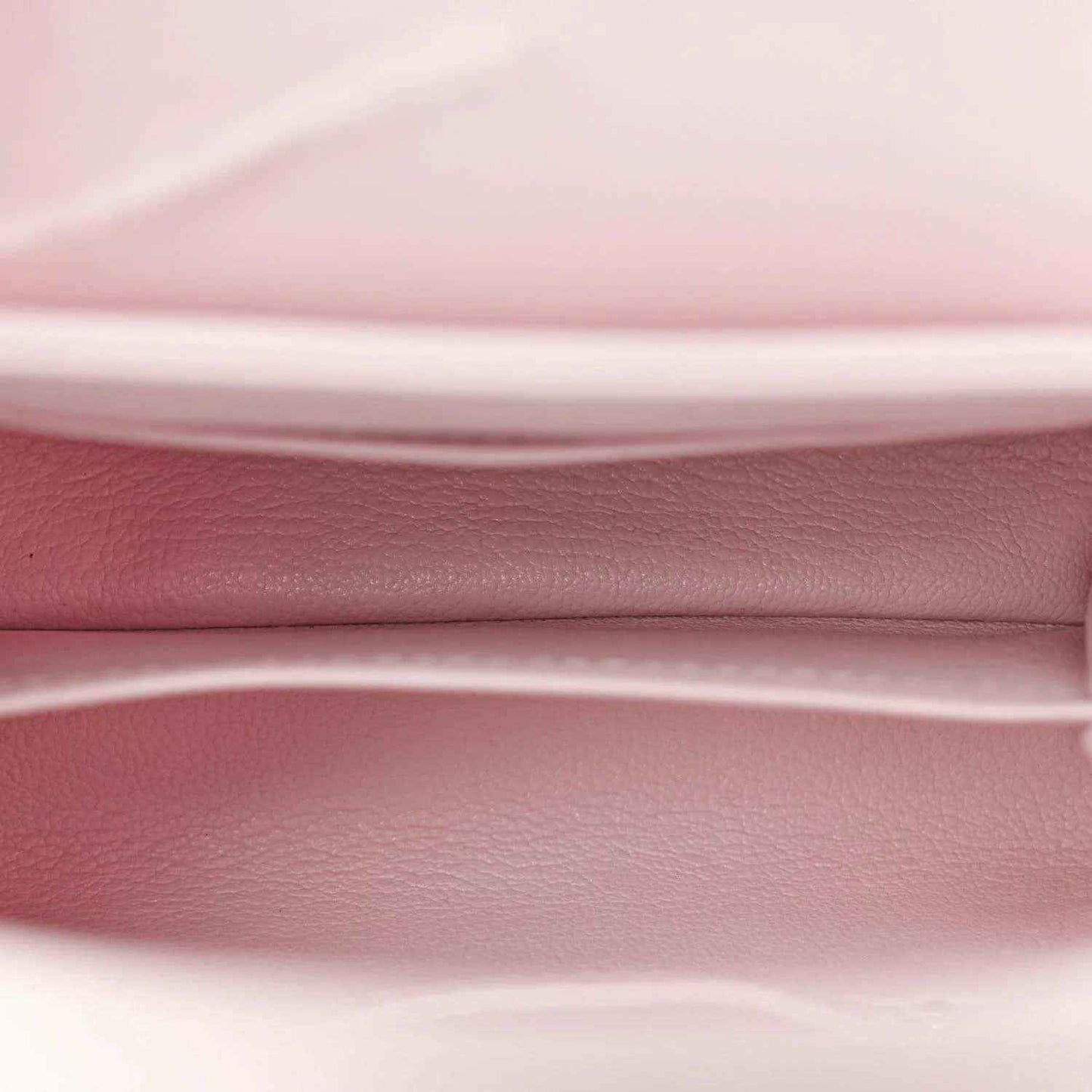Louis Vuitton mini bag interior, pale pink leather lining and top edge close-up
