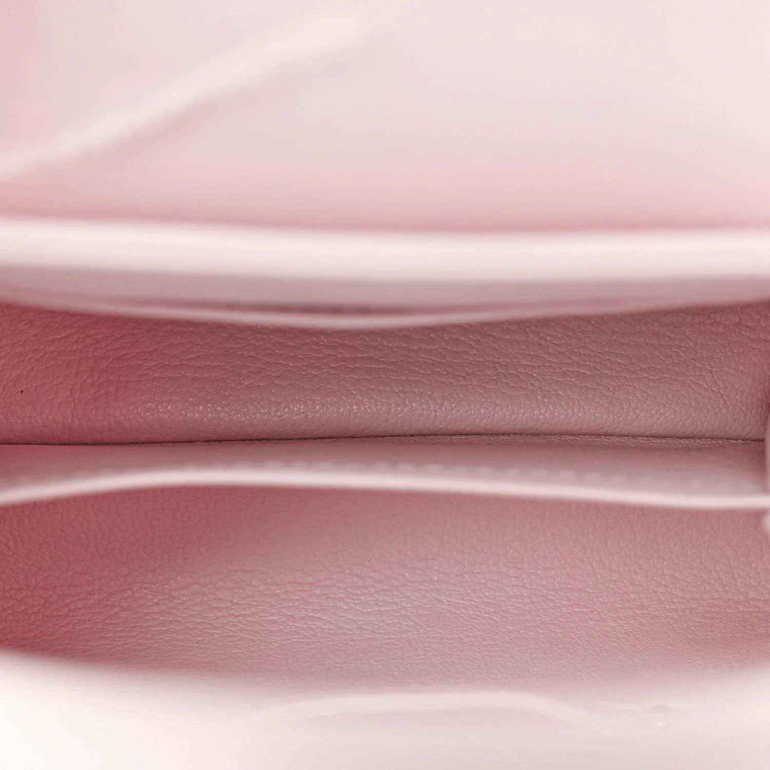 Louis Vuitton mini bag interior, pale pink leather lining and top edge close-up