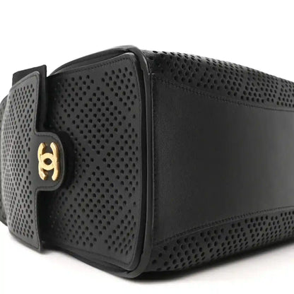 Small black perforated calfskin handbag with gold logo clasp at side