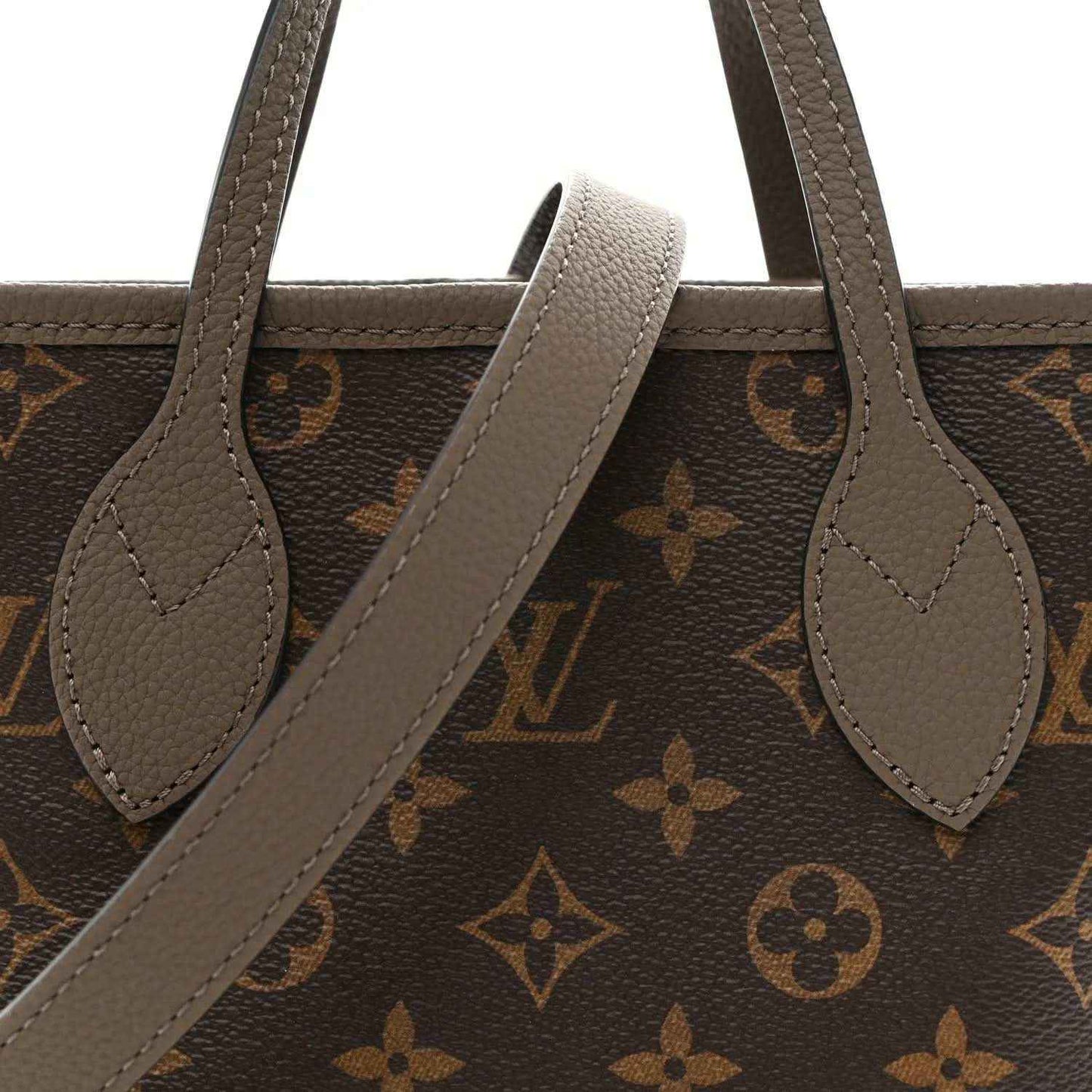 Dark monogram tote with gray leather handles and arched opening strap detail