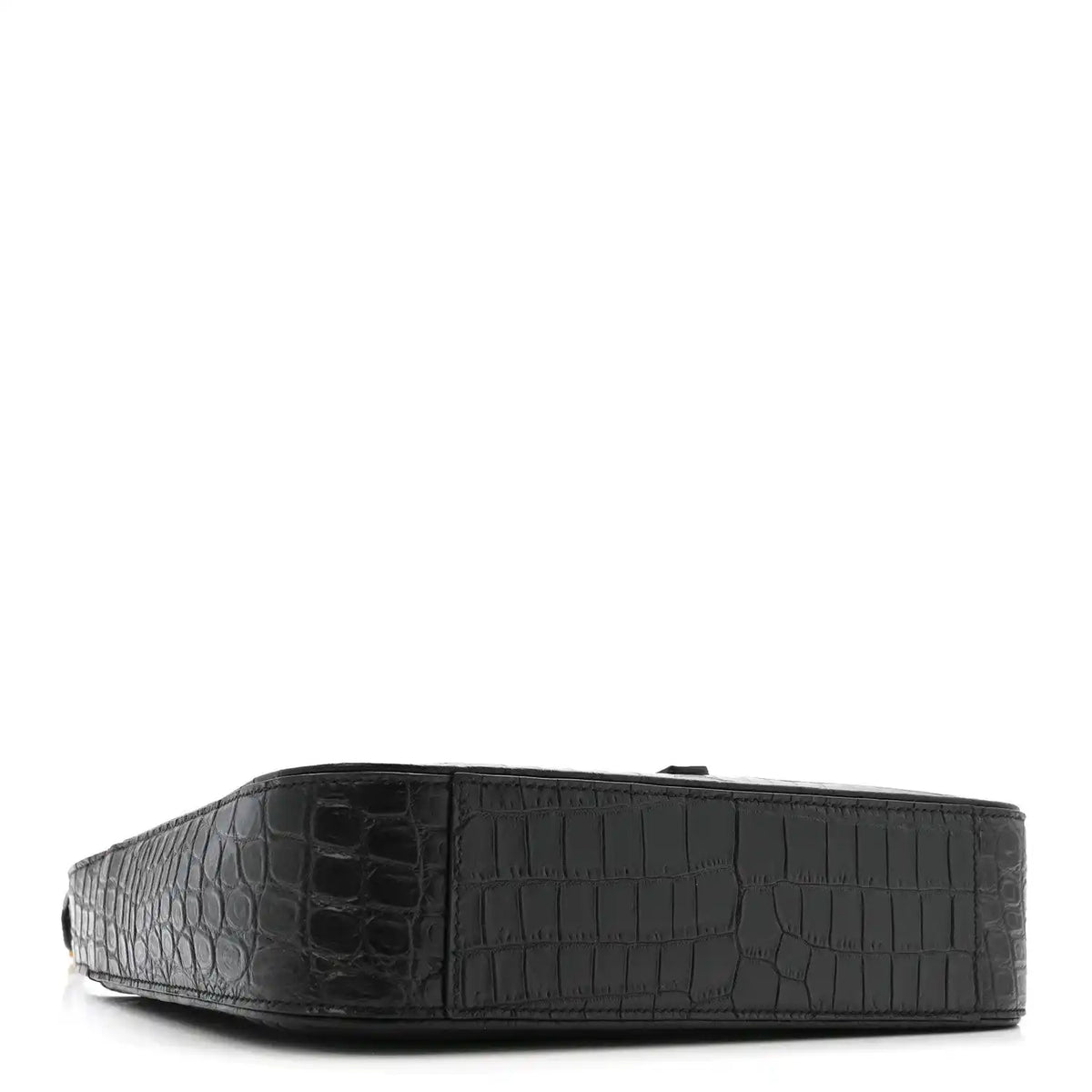Black crocodile-embossed hobo bag, side view with wide base.