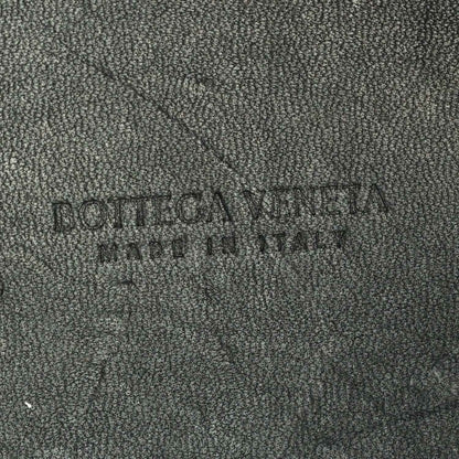 Black leather interior panel with embossed brand name