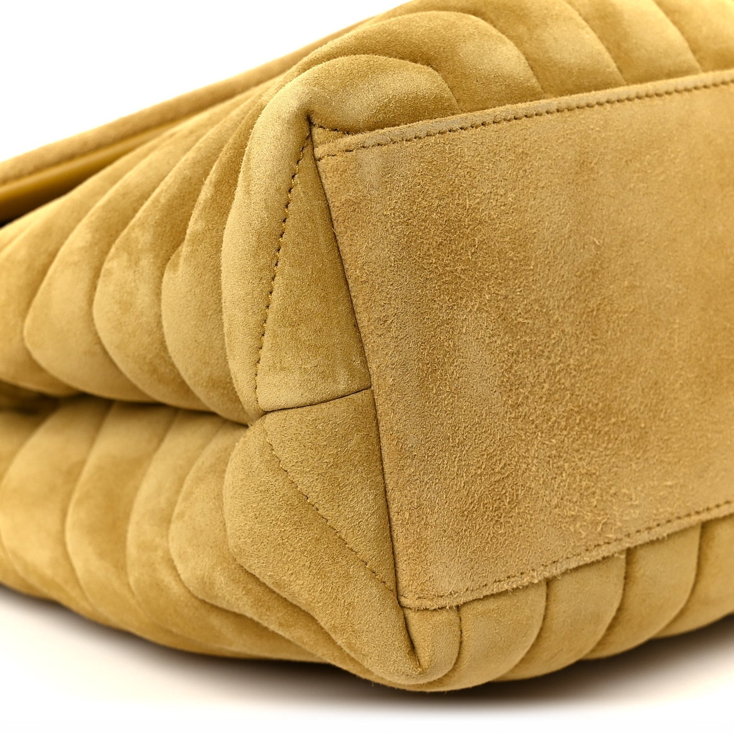 Chartreuse suede quilted satchel with flap edge detail and rounded corner