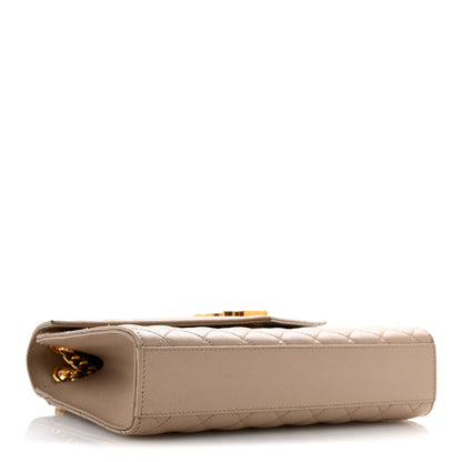 Dark beige quilted satchel side profile with gold chain and flap hardware