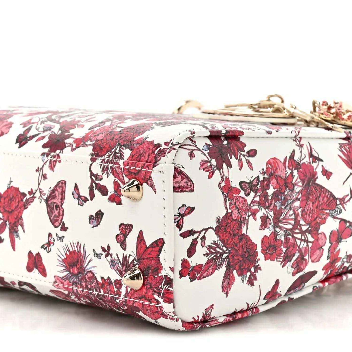 White and red floral handbag with top zipper and quilted side panels