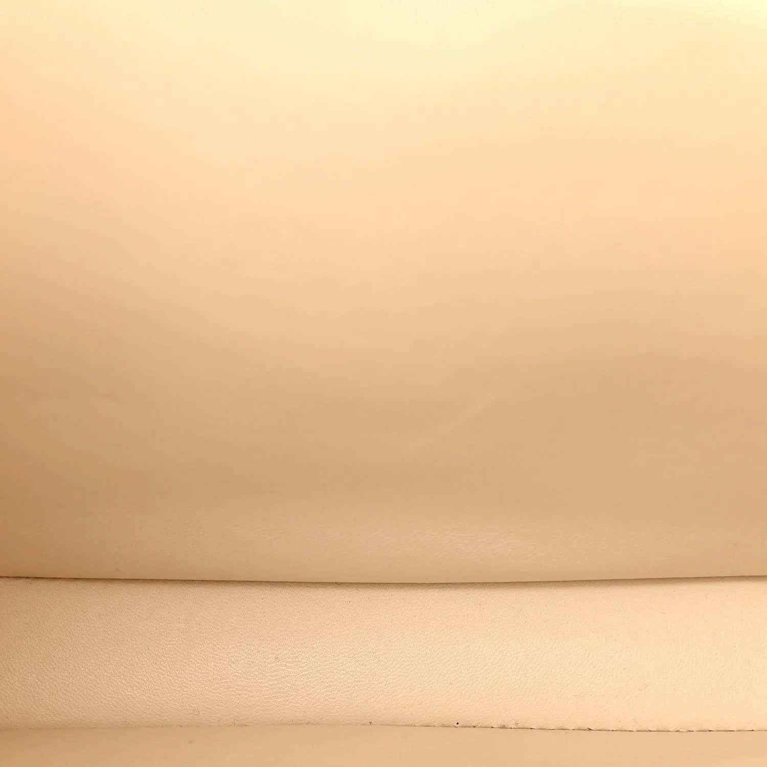 Beige leather surface with subtle grain