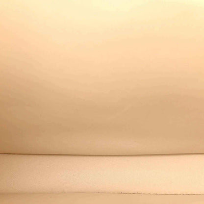 Beige leather surface with subtle grain