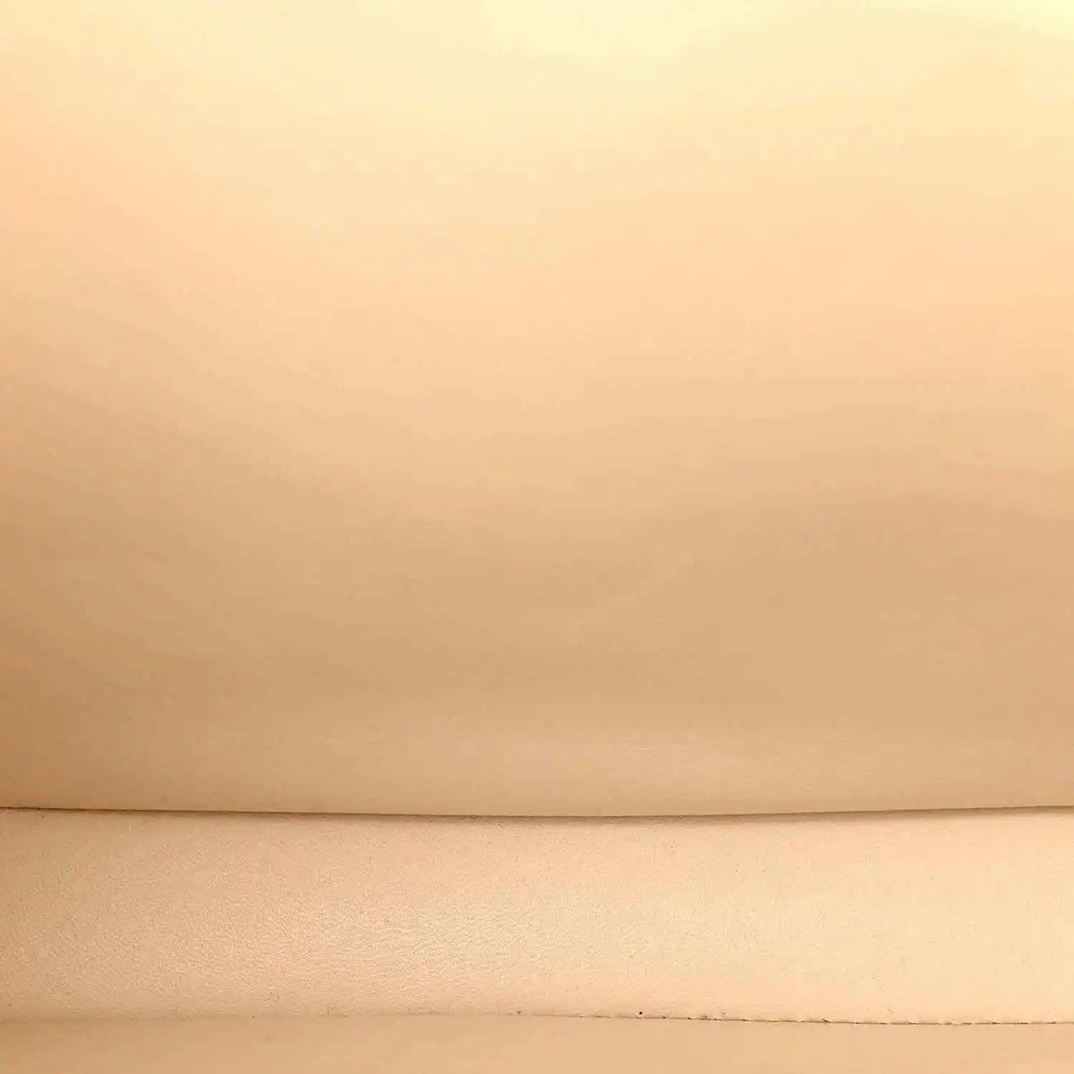 Beige leather surface with subtle grain
