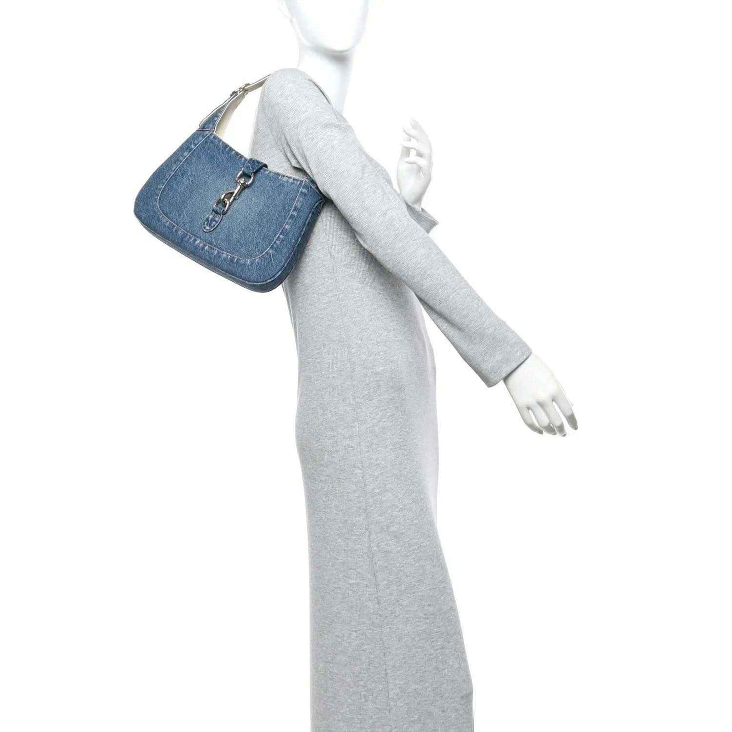 Blue denim small Jackie bag on a mannequin with a short detachable strap
