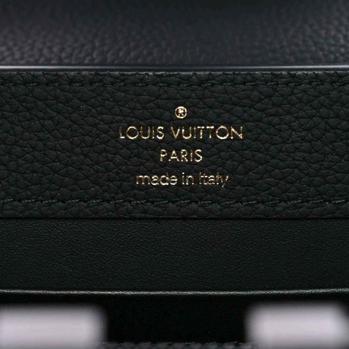 Black leather mini handbag with gold “Louis Vuitton” “Paris” stamp