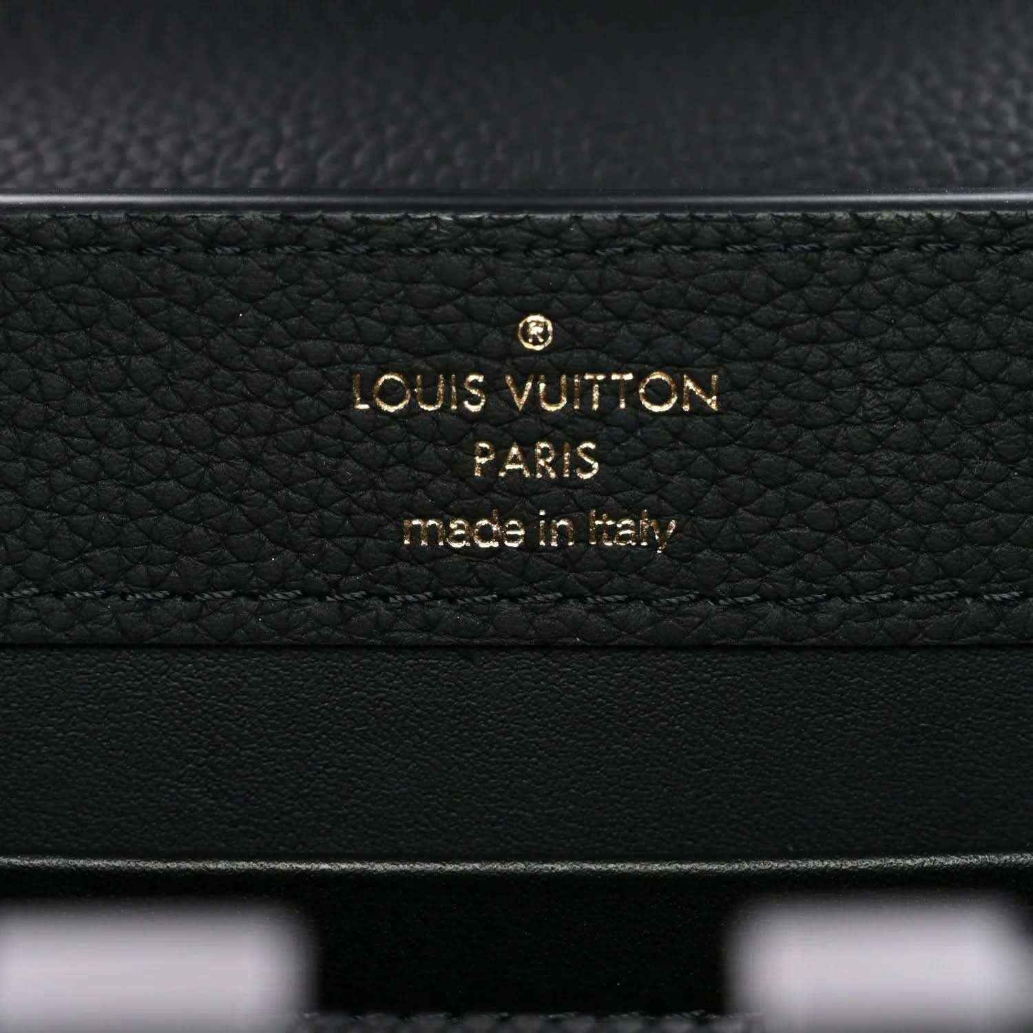 Black leather mini handbag with gold “Louis Vuitton” “Paris” stamp