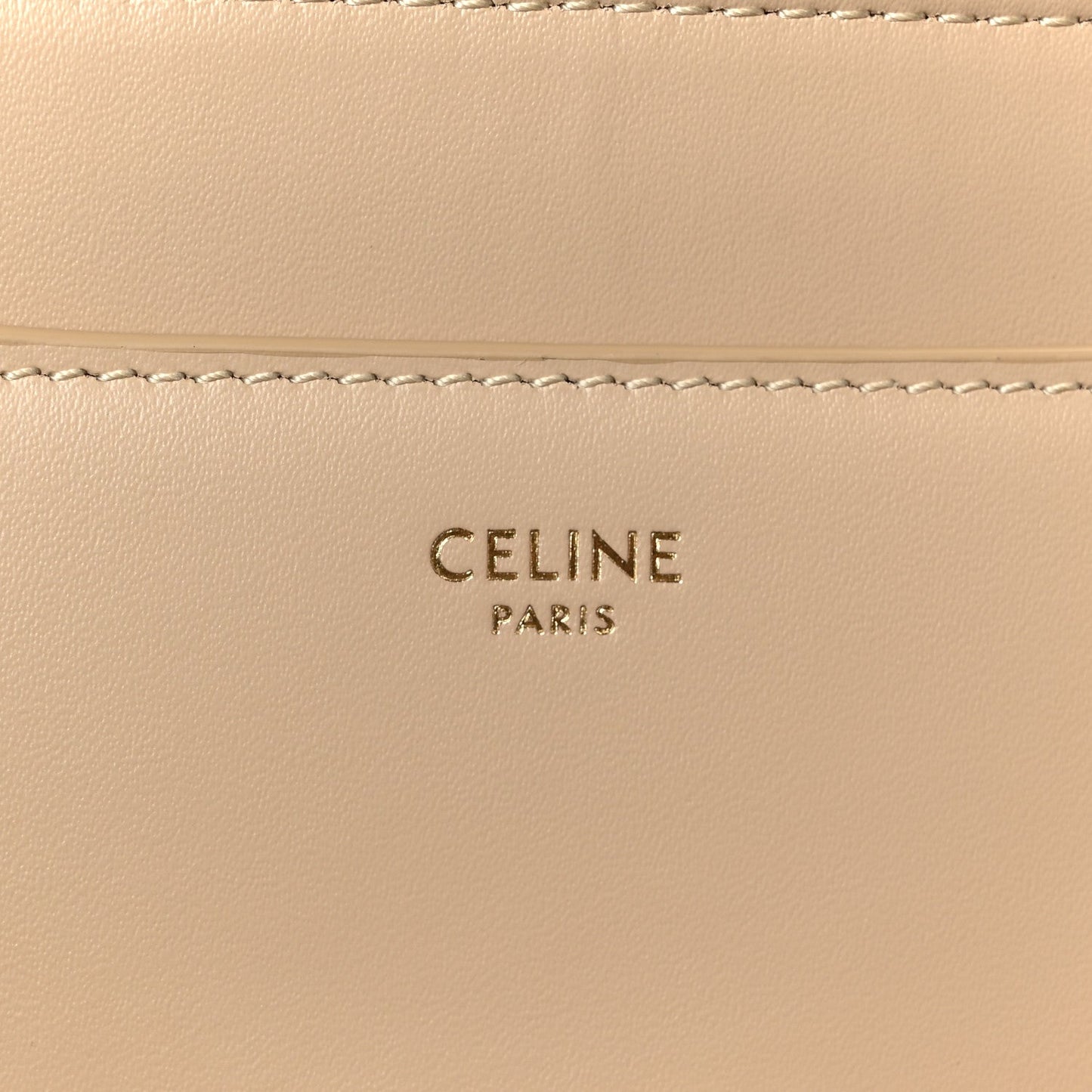 Celine Paris logo stamped on beige leather panel with stitching