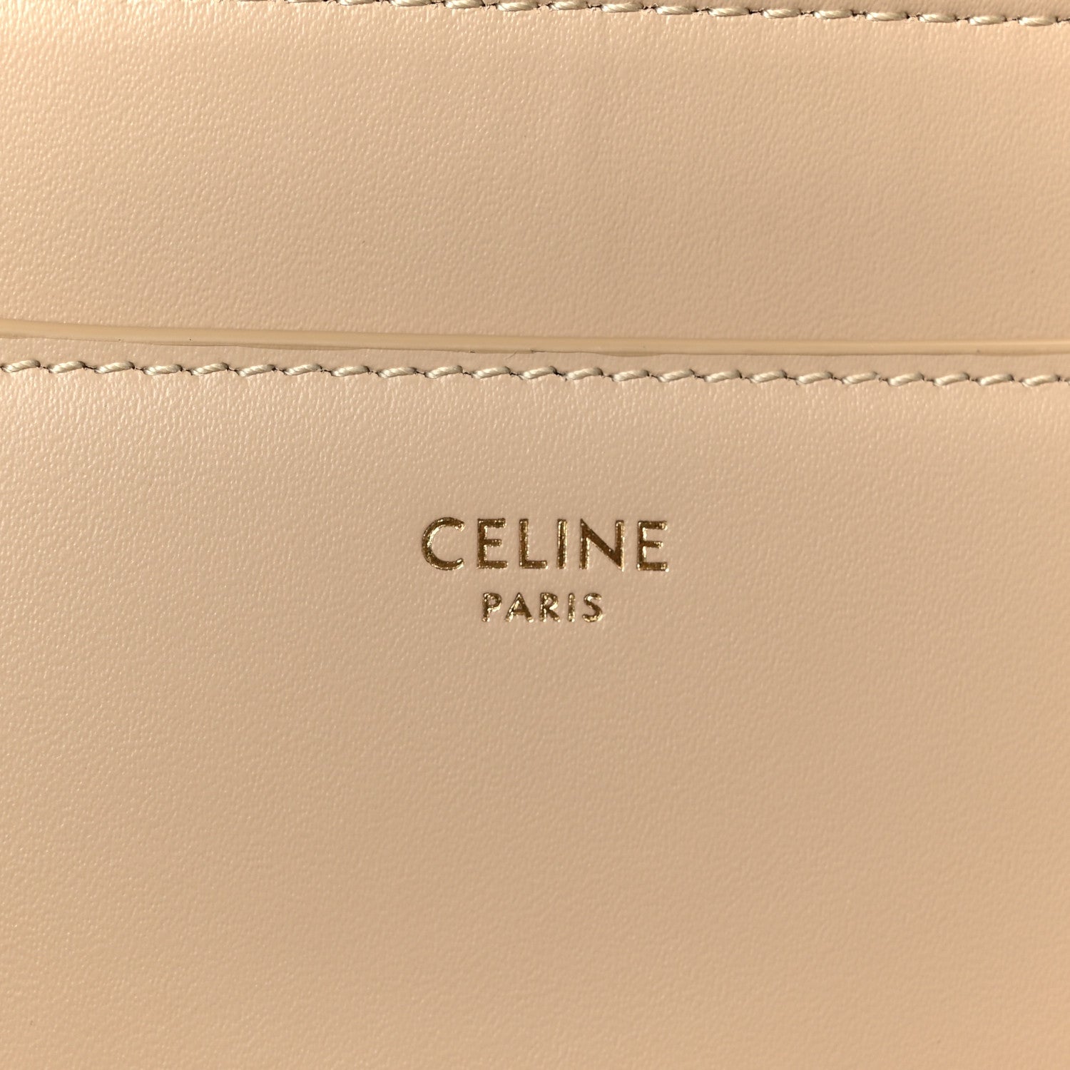 Celine Paris logo stamped on beige leather panel with stitching