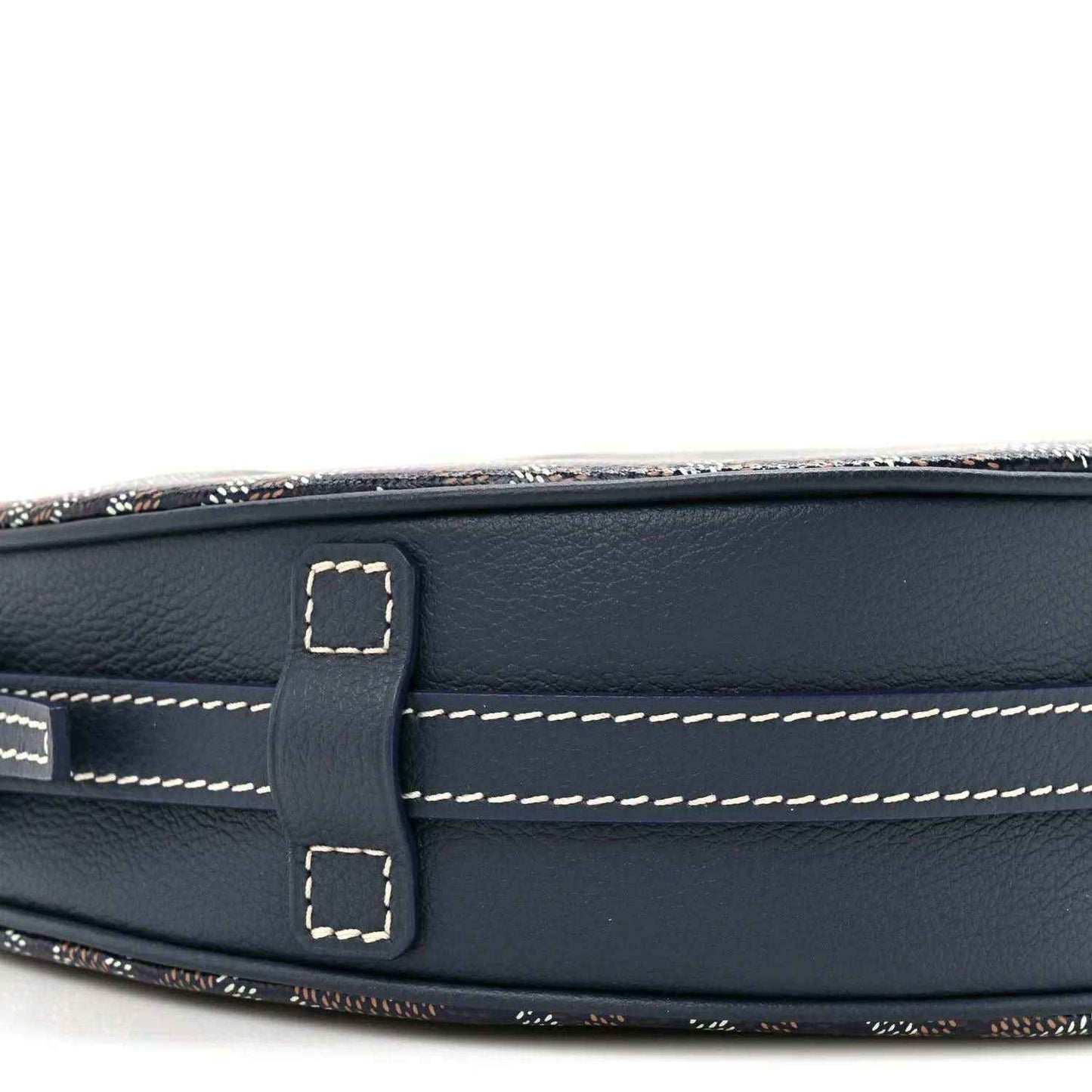 Navy leather strap mount with contrast stitching and buckle, close-up