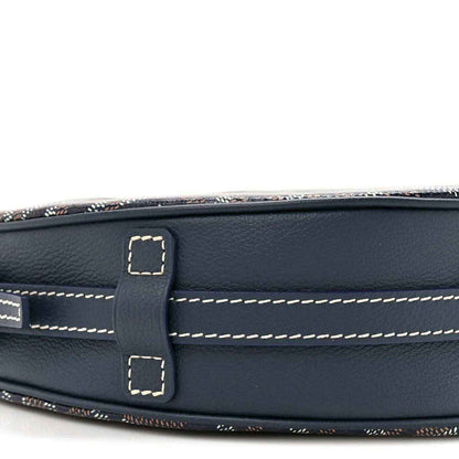 Navy leather strap mount with contrast stitching and buckle, close-up