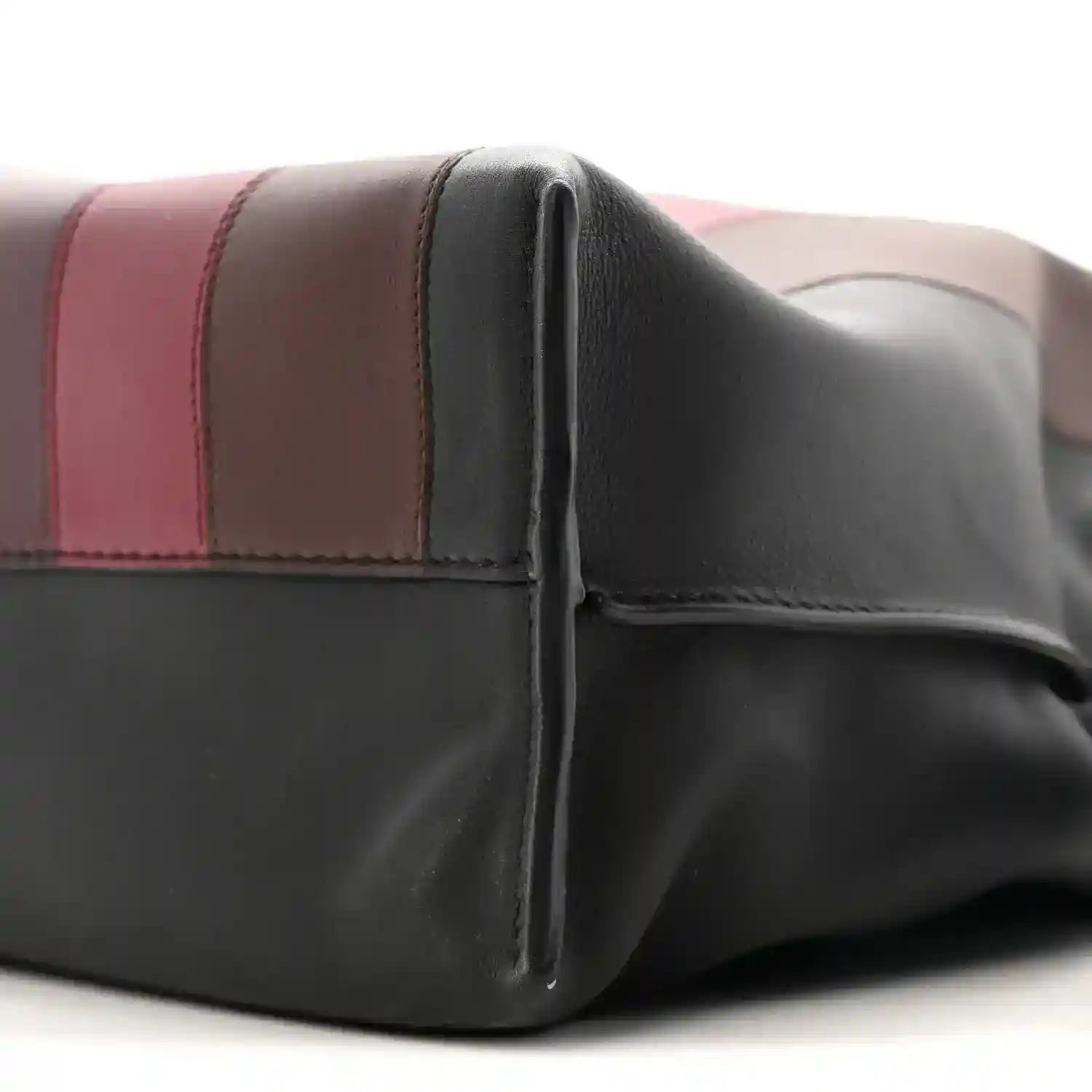 Close view of black calfskin clutch with burgundy stripe and seams