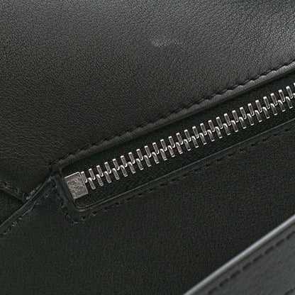 Small Puzzle Edge shoulder bag, black calfskin leather close-up of metal zipper