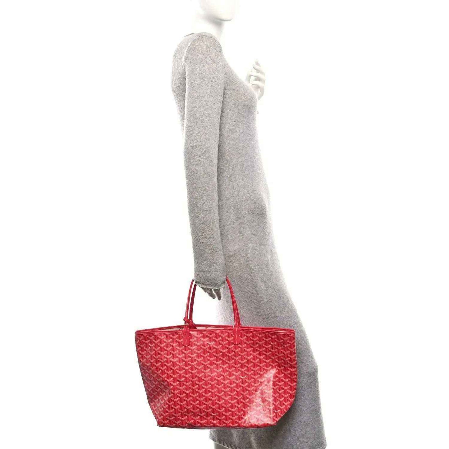 Fuchsia mini pouch attached to the side of a patterned tote bag with top handles