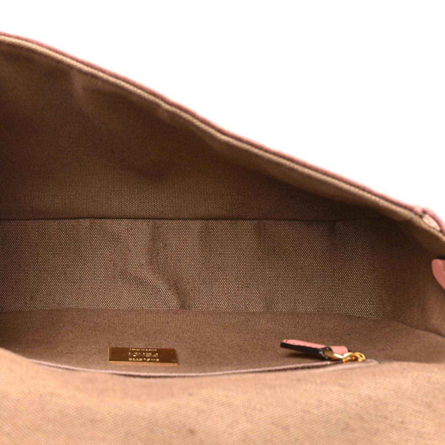 Fendi baguette shoulder bag interior with fabric lining, small tag, and zipper pocket
