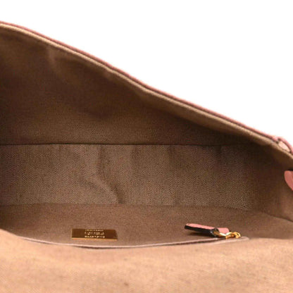 Fendi baguette shoulder bag interior with fabric lining, small tag, and zipper pocket