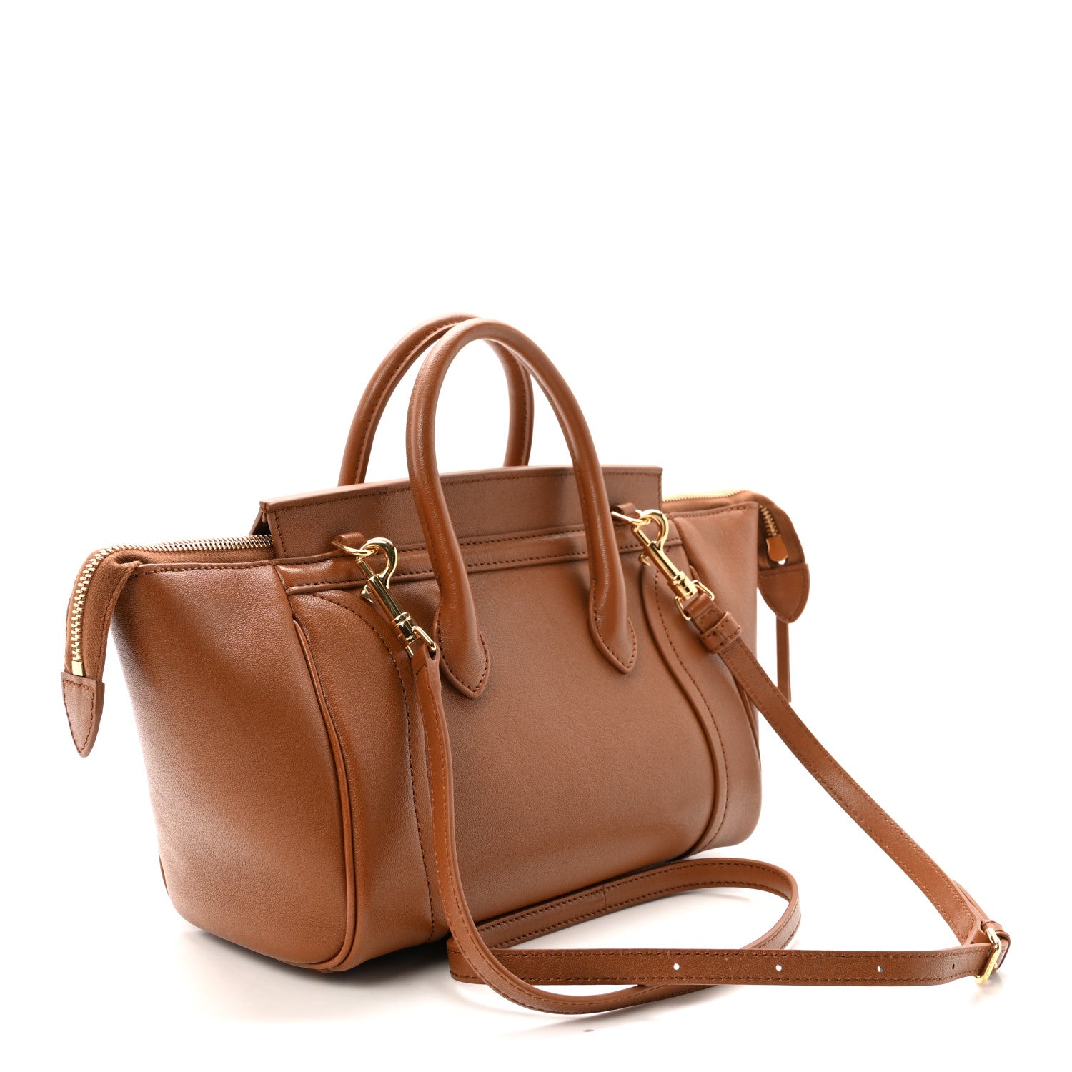 Tan leather tote with dual top handles and long shoulder strap, side angle