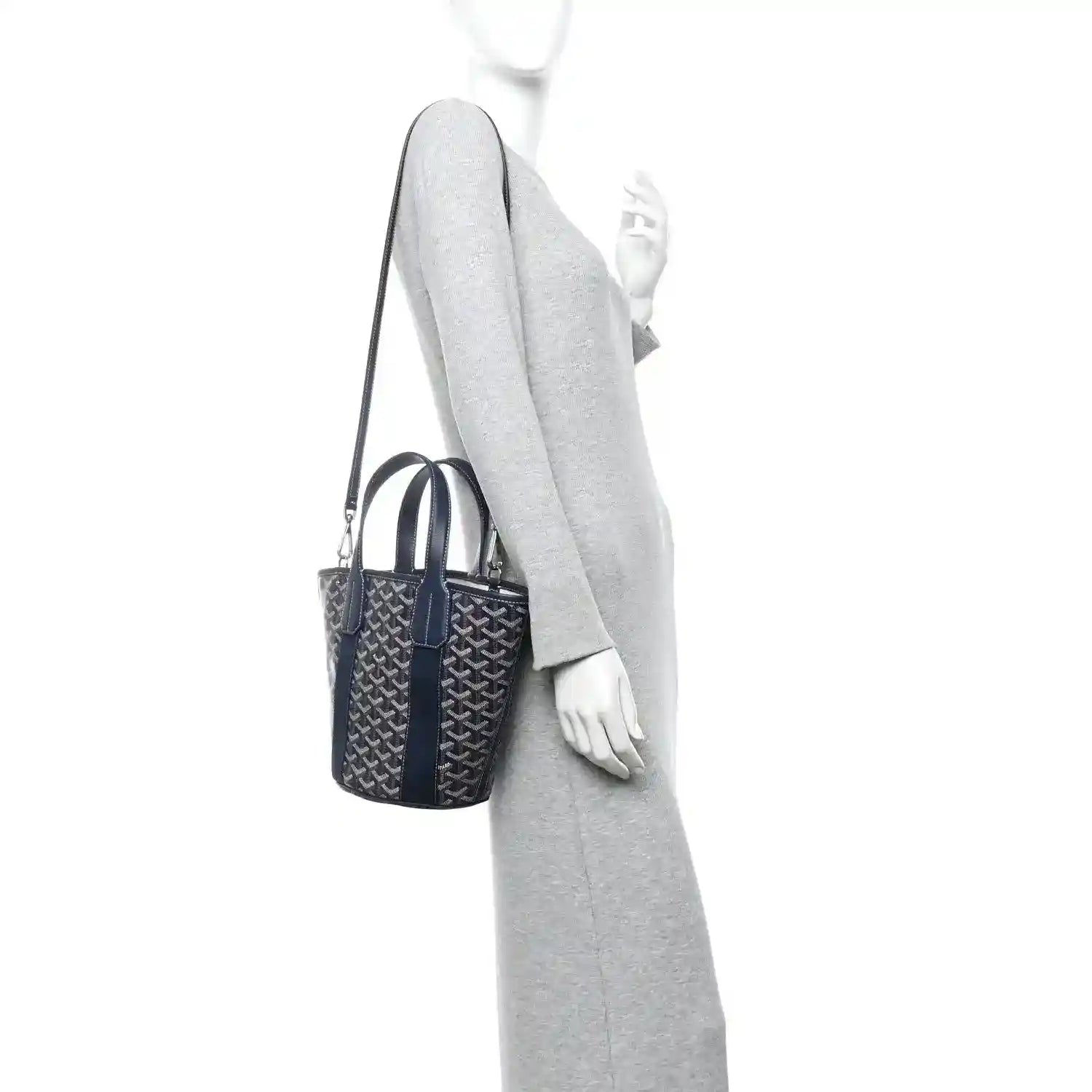 Navy patterned tote bag worn on a shoulder strap with top handles