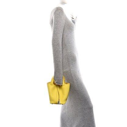 Lime leather mini tote with top handles and turn-lock clasp