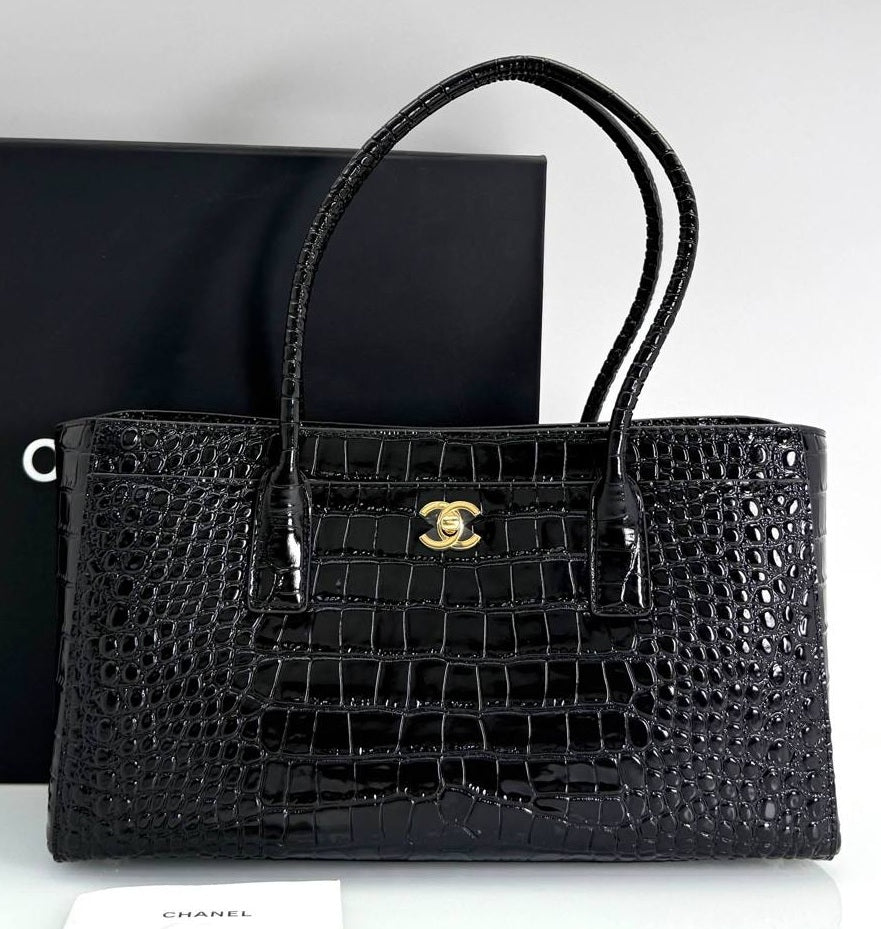 Black croc-embossed calfskin shopping tote with front logo medallion and top handles