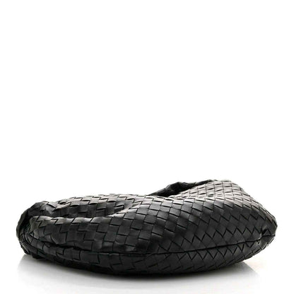 Small black leather shoulder bag, side view with intrecciato woven pattern