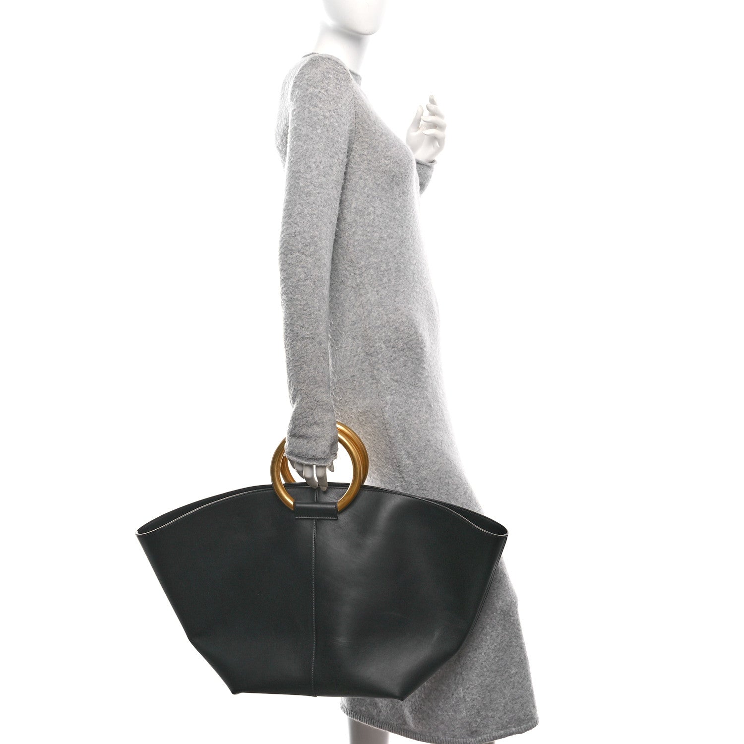 Black smooth calfskin trapezoid shopping tote with gold ring top handle