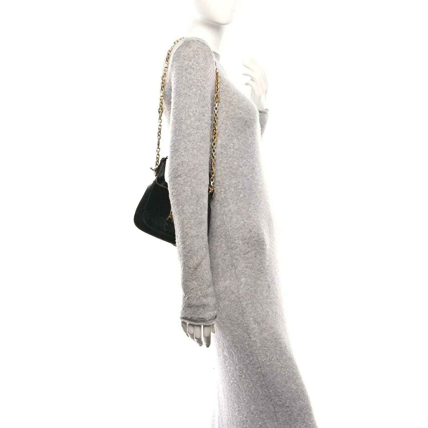 Black mini Jackie handbag with chain shoulder strap, shown from the side.