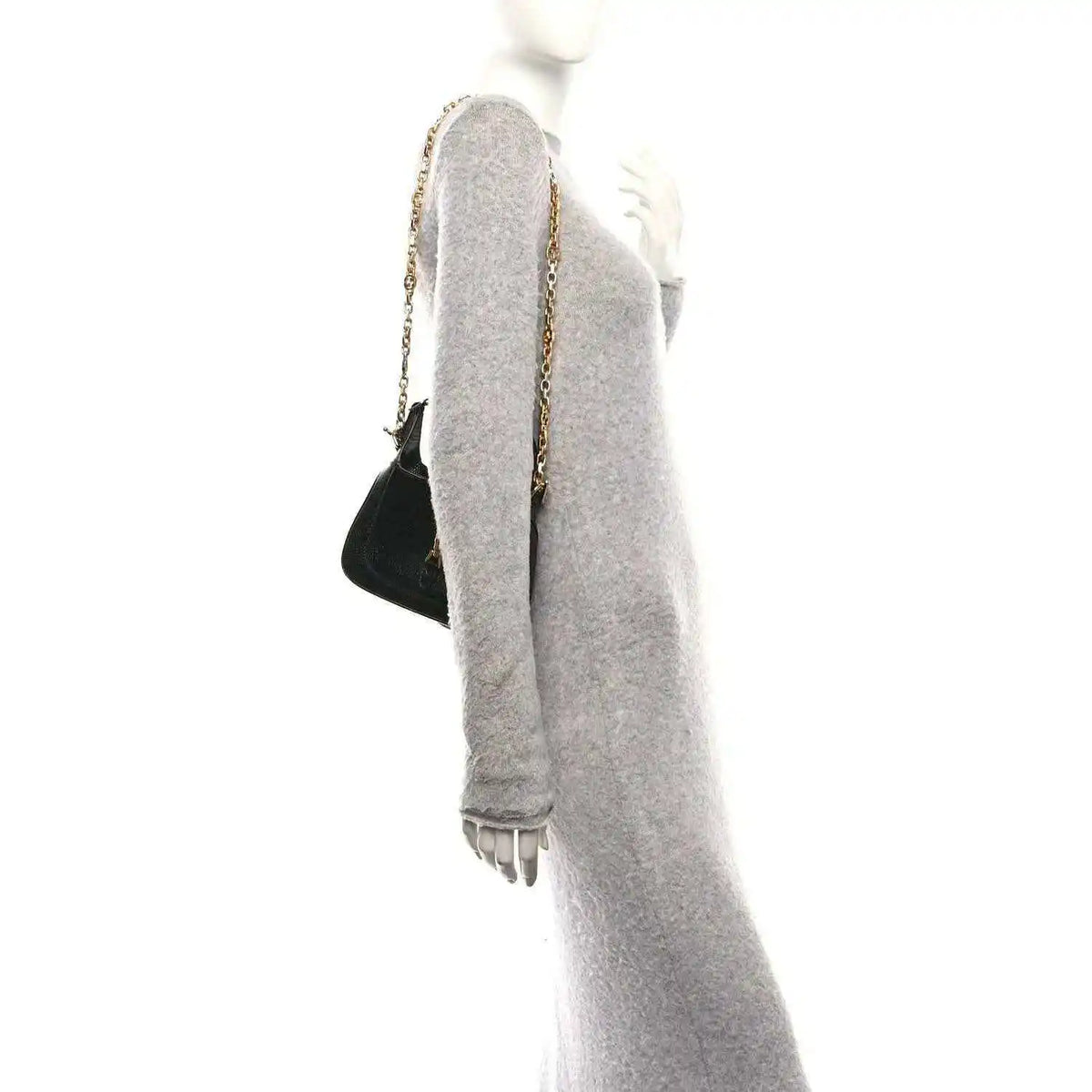 Black mini Jackie handbag with chain shoulder strap, shown from the side.
