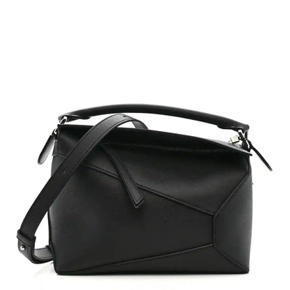 Small Puzzle Edge shoulder bag in black leather with top handle and shoulder strap
