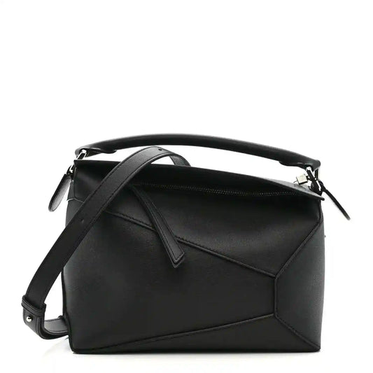 Small Puzzle Edge shoulder bag in black leather with top handle and shoulder strap