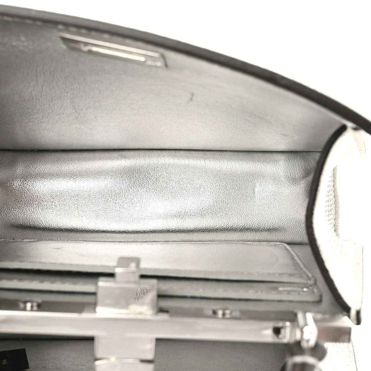Satchel interior lining with top hinge and hardware detail