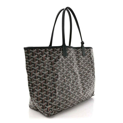Black patterned tote bag with long top handles and structured base