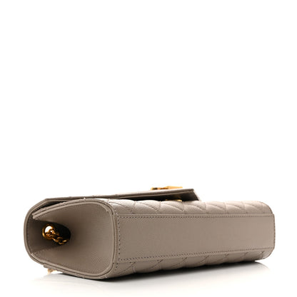 Greyish brown small satchel with open top, side logo, and gold-tone hardware