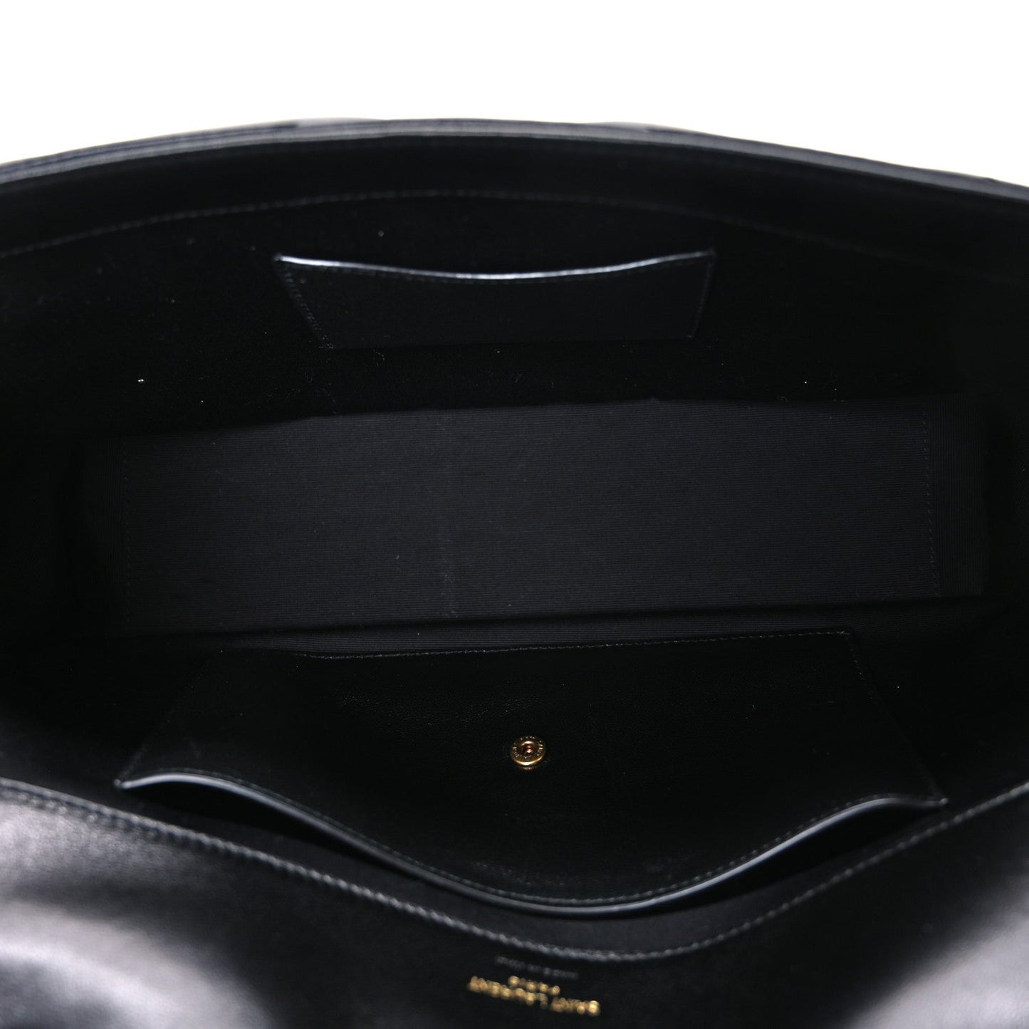 Black leather shoulder bag interior with stitched lining and inner pocket