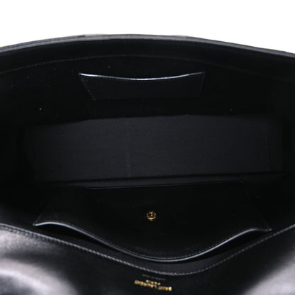 Black leather shoulder bag interior with stitched lining and inner pocket