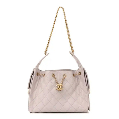 Lilac quilted small handbag with gold chain shoulder strap and Chanel CC turn-lock