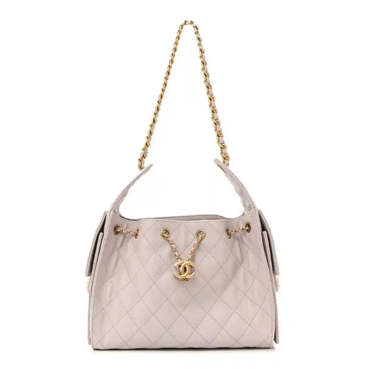 Lilac quilted small handbag with gold chain shoulder strap and Chanel CC turn-lock