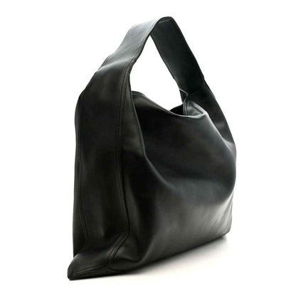 Bottega Veneta Large Hop bag, silky black calfskin, side profile with curved handle