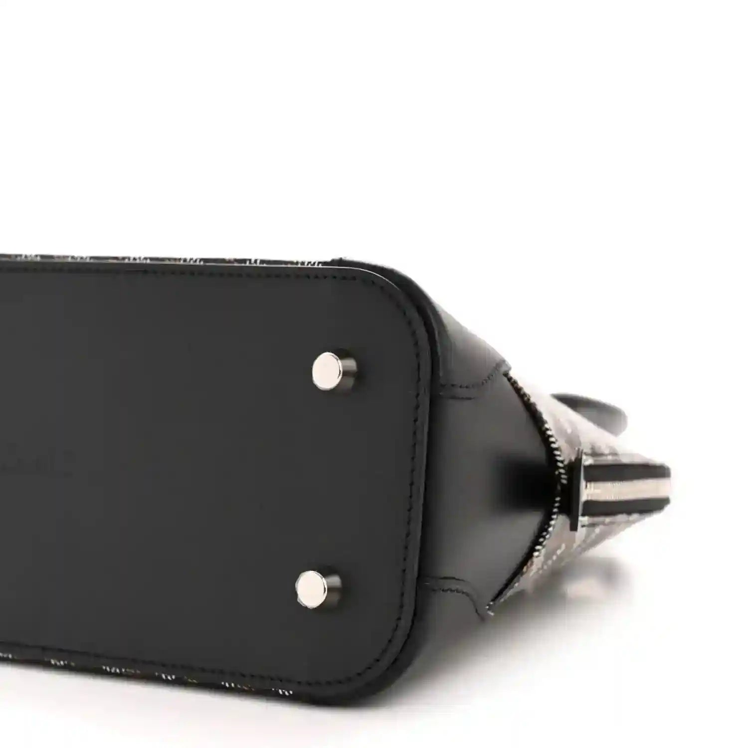 Black mini bag end with silver rivets and zipper closure, plus side seam detail