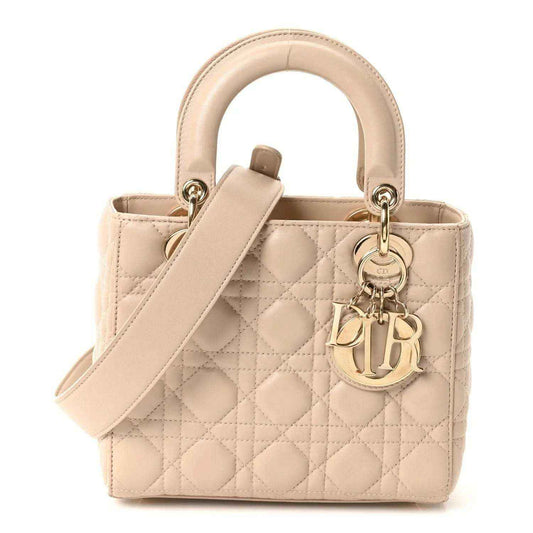 Beige quilted lambskin mini handbag with top handle and fabric wrist strap