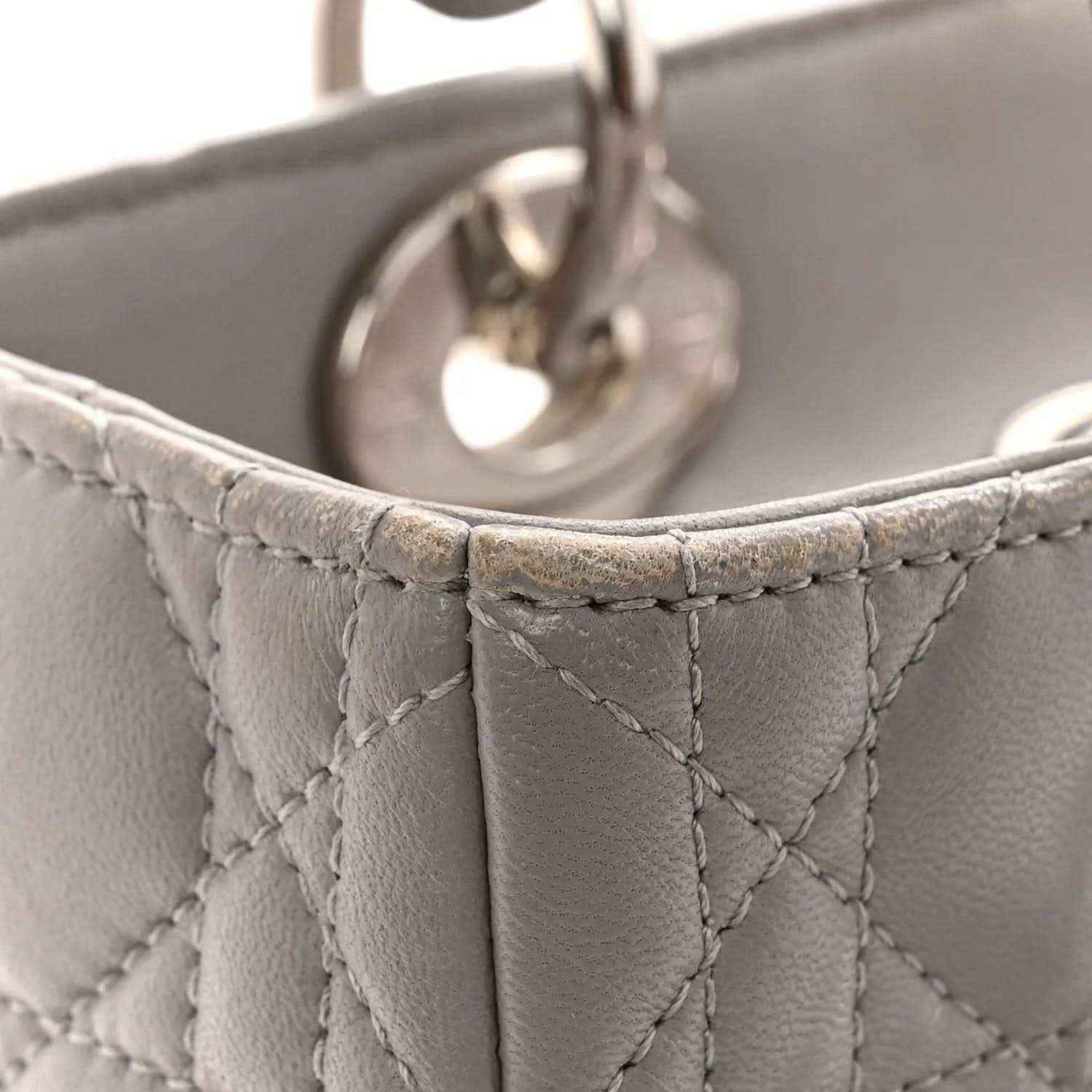 Grey quilted lambskin handbag top edge and stitching with partial metal hardware