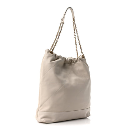 Cream lambskin tote bag with chain handles, gathered top, quilted panel detail